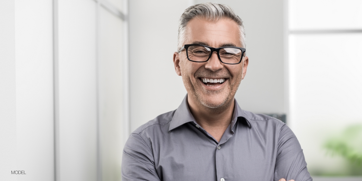 man with glasses and dental implants